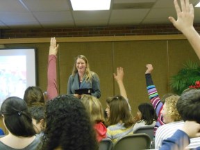 Students with their hands raised